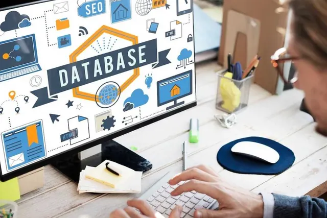 Database administrator monitoring query performance on a desktop screen during database tuning
