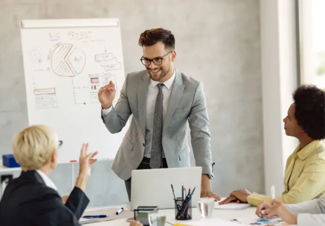 IT strategy workshop — a Sysfo consultant presenting a technology roadmap on a whiteboard