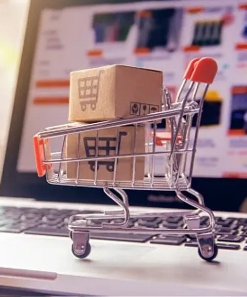 Shopping cart with parcels on a laptop for online shopping