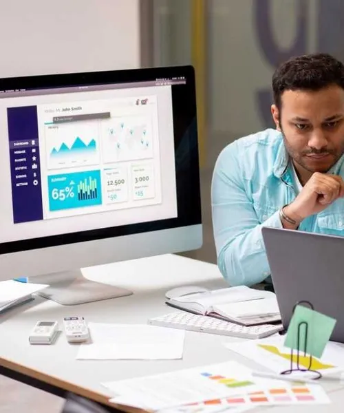 IT consultants reviewing a business dashboard