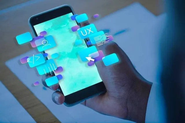Hand holding a smartphone running a mobile-ready progressive web application interface